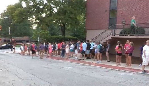 students standing outside of dorm during fire drill