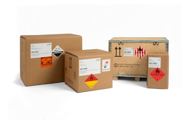 various shipping boxes with hazmat labels