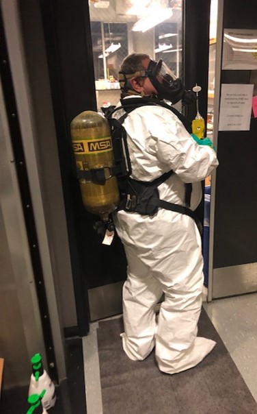 man wearing SCBA and spill protection