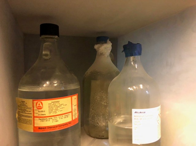 3 chemical bottles with crystals