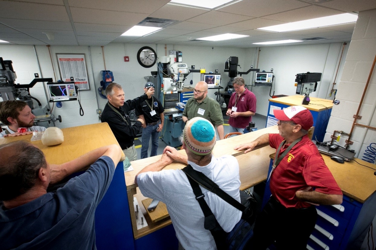 conference participants on a tour of a Georgia Tech shop