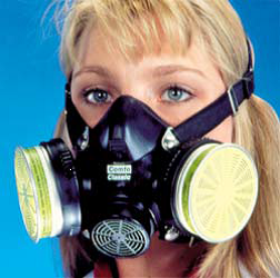 woman wearing half face respirator