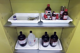 bottles in trays as secondary containment